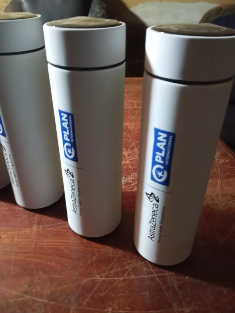 White insulated flasks printed with partner logos